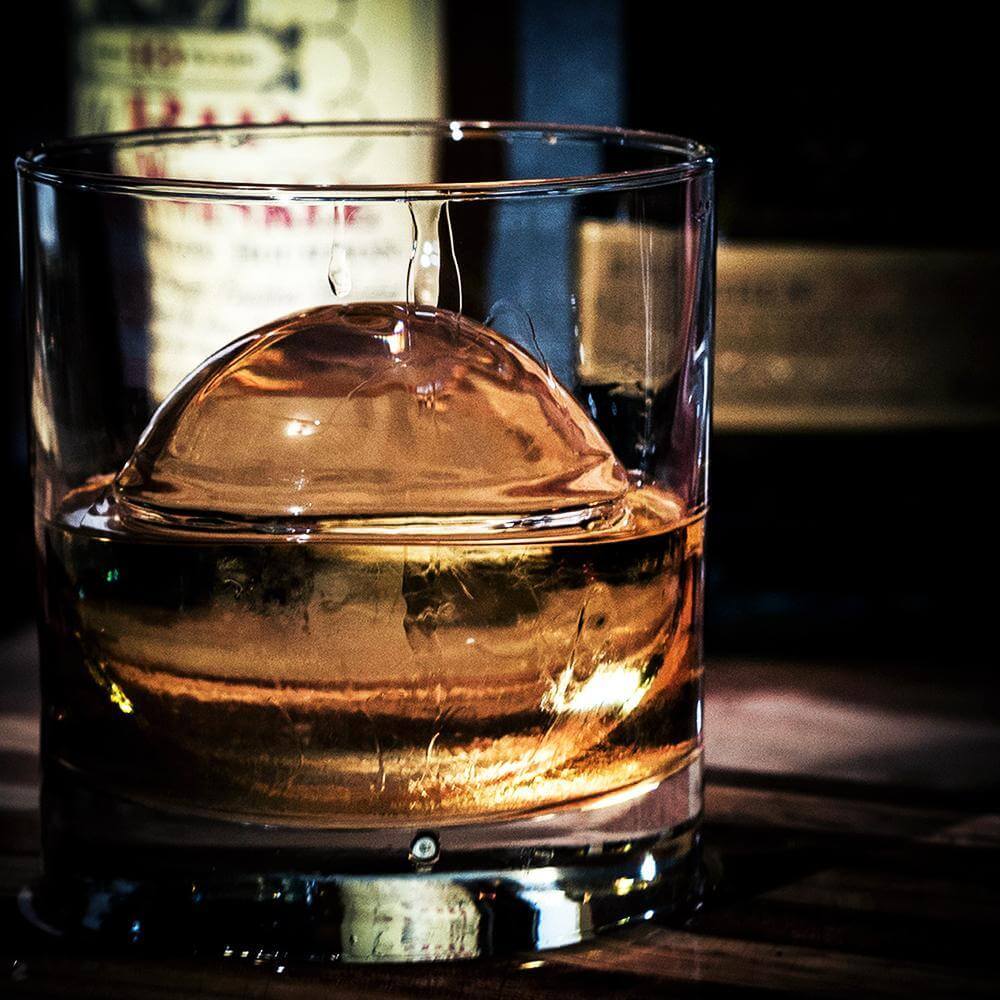 Bourbon Whiskey With A Sphere Ice Cube Ready To Drink Stock Photo, Picture  and Royalty Free Image. Image 43784532.